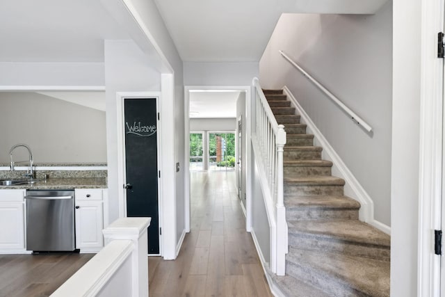 interior space with dark wood finished floors and stairway