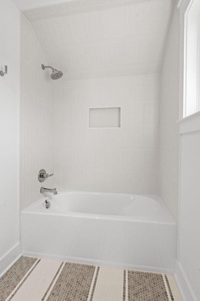 full bathroom featuring tile patterned floors, shower / bathtub combination, and baseboards