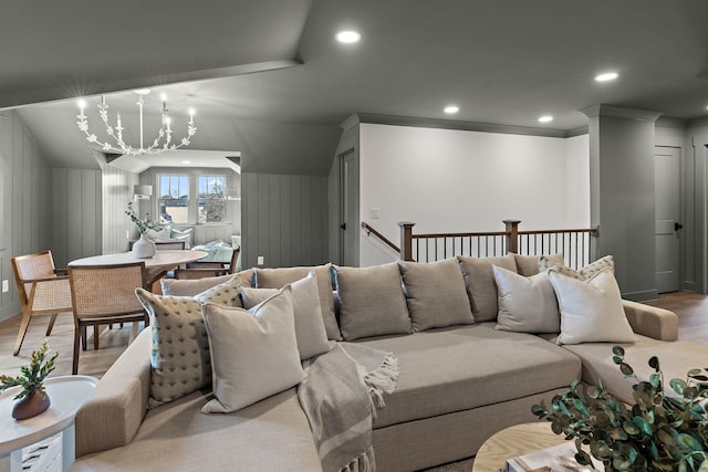 living room with light wood-style flooring, recessed lighting, and a chandelier
