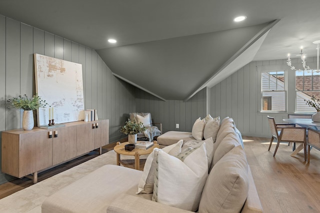 additional living space with hardwood / wood-style flooring, lofted ceiling, a chandelier, and recessed lighting