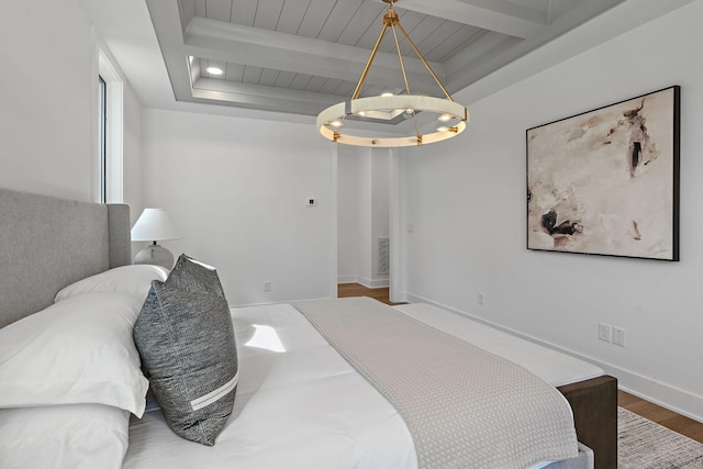 bedroom featuring a chandelier, wood finished floors, a raised ceiling, baseboards, and beamed ceiling