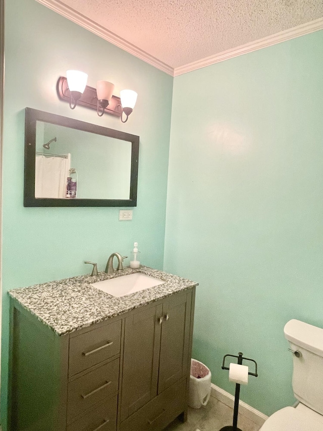 bathroom with crown molding, toilet, a textured ceiling, vanity, and baseboards