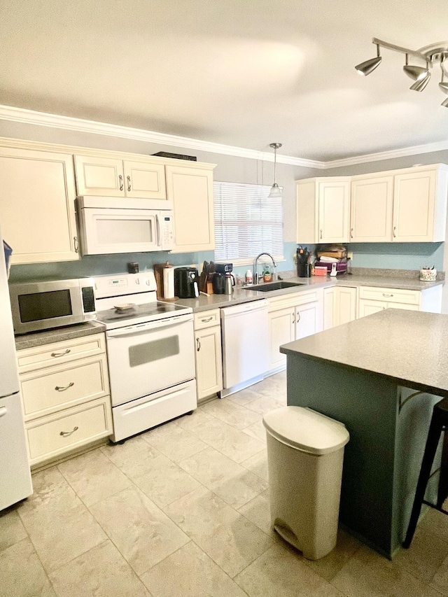 kitchen featuring white appliances, a sink, crown molding, hanging light fixtures, and light countertops