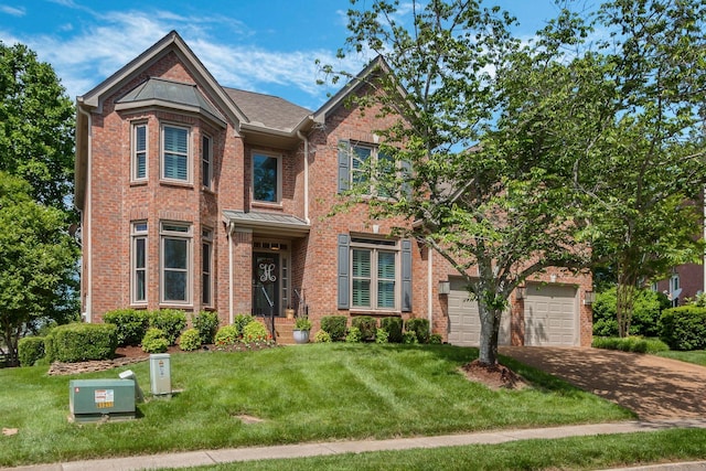 248 Stonehaven Cir, Franklin, TN 37064 - view of front of home featuring brick siding, a garage, a front lawn, and driveway