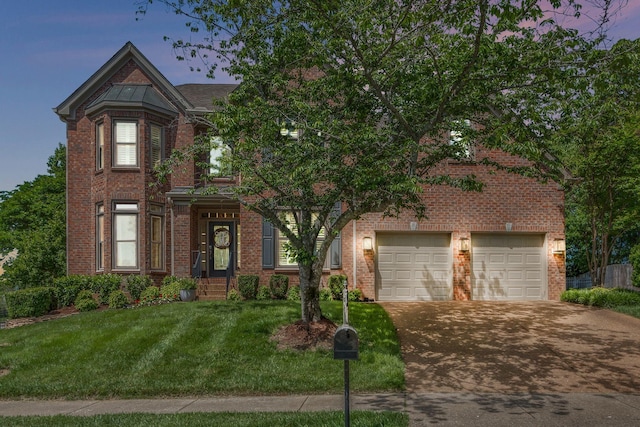248 Stonehaven Cir, Franklin, TN 37064 - view of front facade featuring brick siding, driveway, a garage, and a front lawn
