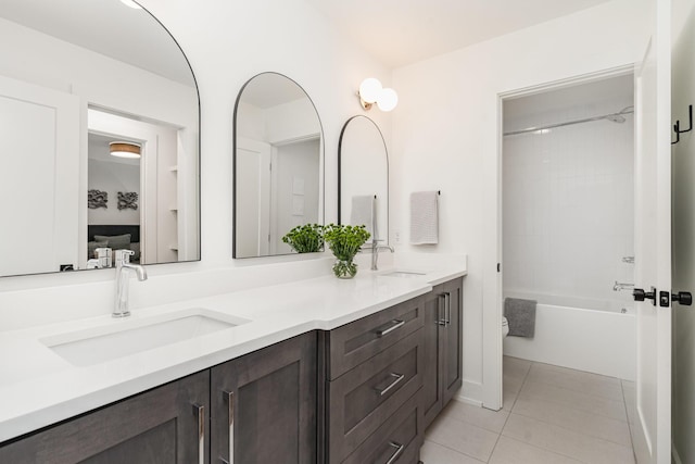 1411A Boscobel St, Nashville, TN 37206 - bathroom featuring double vanity, tile patterned floors, toilet, and  shower combination