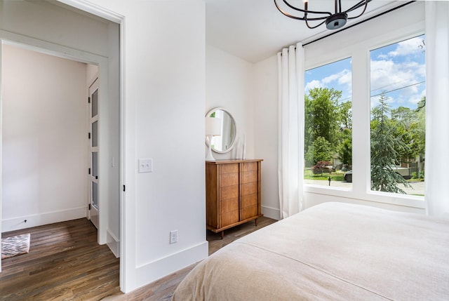 1411A Boscobel St, Nashville, TN 37206 - bedroom featuring baseboards, wood finished floors, and a chandelier
