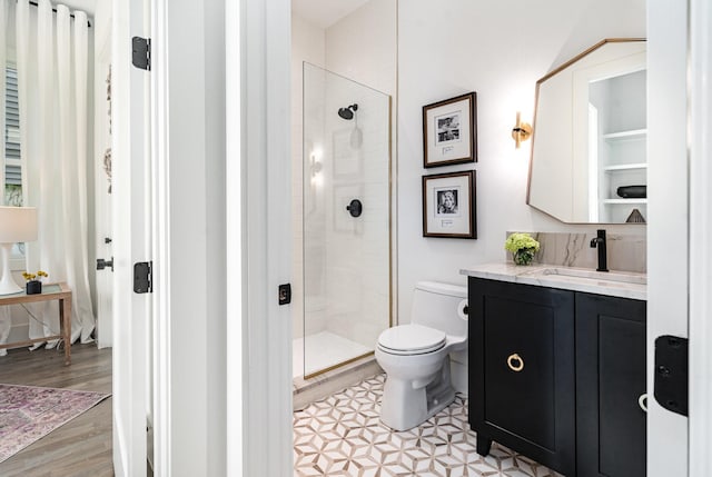 1411A Boscobel St, Nashville, TN 37206 - full bath with toilet, vanity, tiled shower, and wood finished floors