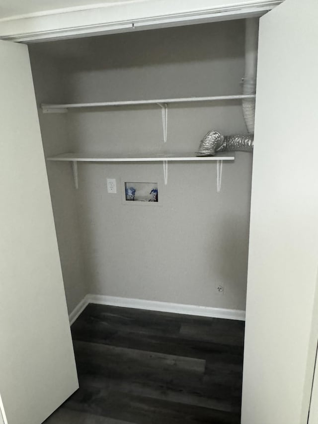 laundry area with washer hookup, baseboards, and dark wood-type flooring