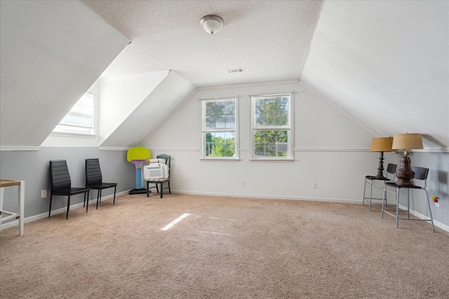 1505 Roane St, Covington, TN 38019 - additional living space with carpet floors, lofted ceiling, and a textured ceiling