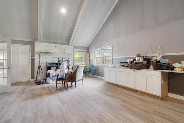 1505 Roane St, Covington, TN 38019 - living area with light wood-style floors, a brick fireplace, and baseboards