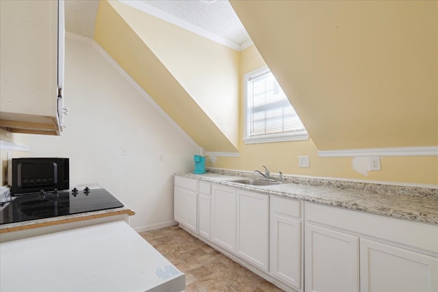 1505 Roane St, Covington, TN 38019 - kitchen featuring a sink, white cabinets, ornamental molding, and black microwave