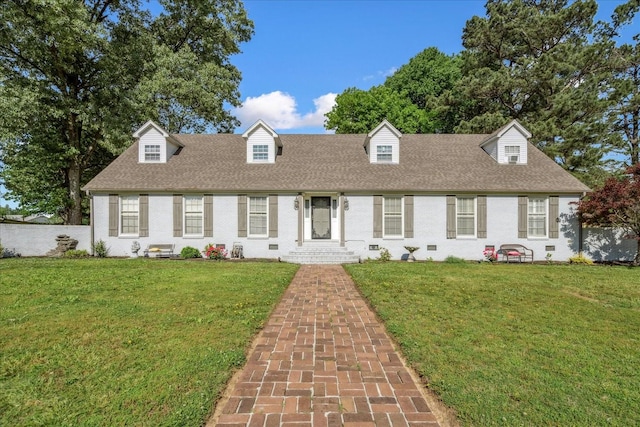 1505 Roane St, Covington, TN 38019 - cape cod house featuring roof with shingles and brick siding