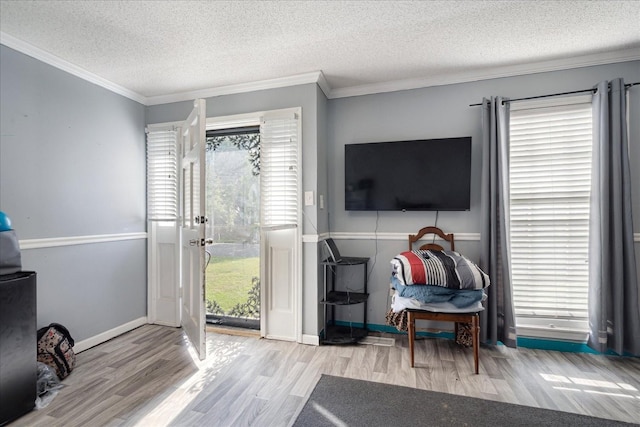 1505 Roane St, Covington, TN 38019 - interior space with access to outside, wood finished floors, a textured ceiling, crown molding, and baseboards