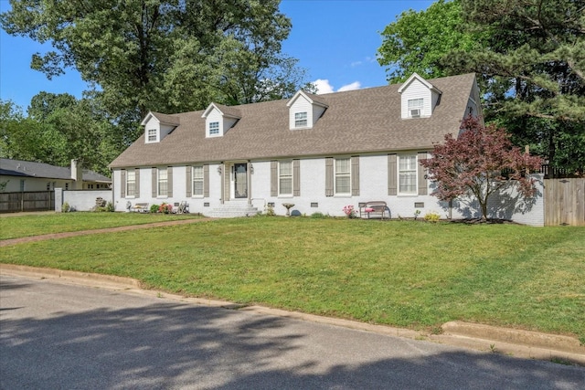 1505 Roane St, Covington, TN 38019 - cape cod-style house featuring roof with shingles and brick siding