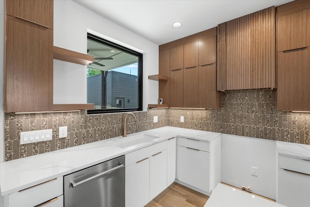 2010B 9th Ave N, Nashville, TN 37208 - kitchen with open shelves, stainless steel dishwasher, a sink, light stone countertops, and modern cabinets