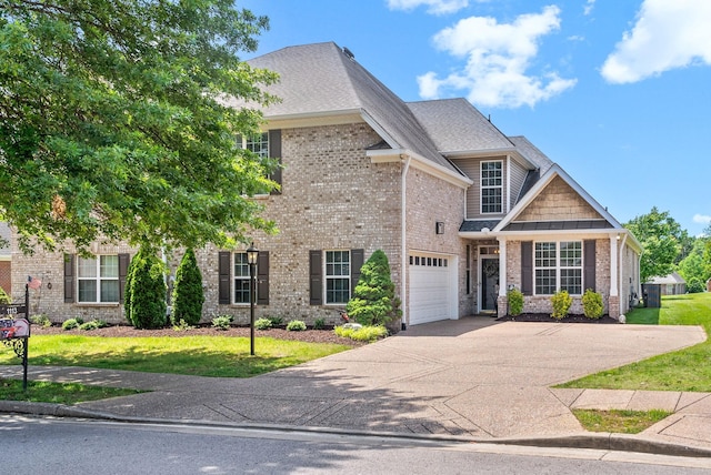 1113 Chickadee Cir, Hermitage, TN 37076 - view of front of property with driveway, brick siding, and a front lawn