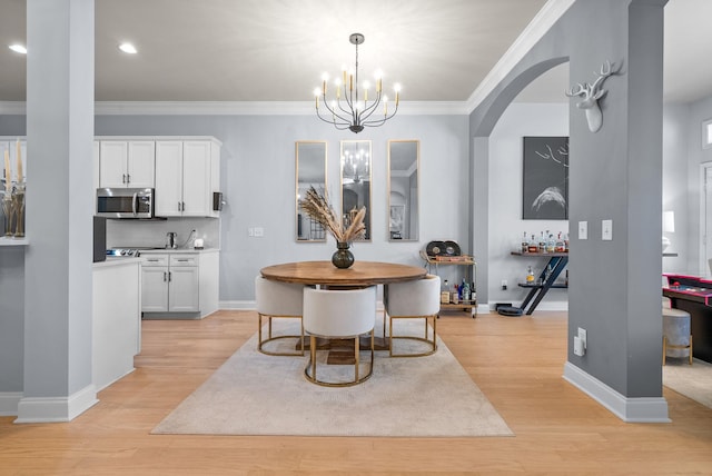 1113 Chickadee Cir, Hermitage, TN 37076 - dining room with light wood-style flooring, ornamental molding, baseboards, recessed lighting, and a chandelier