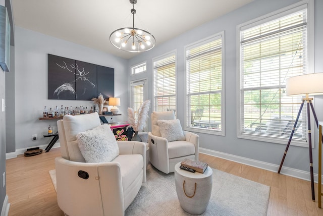 1113 Chickadee Cir, Hermitage, TN 37076 - sitting room featuring a chandelier, wood finished floors, and baseboards