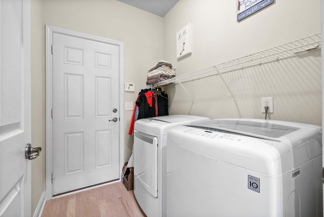 1113 Chickadee Cir, Hermitage, TN 37076 - laundry room with separate washer and dryer, light wood-style flooring, and baseboards