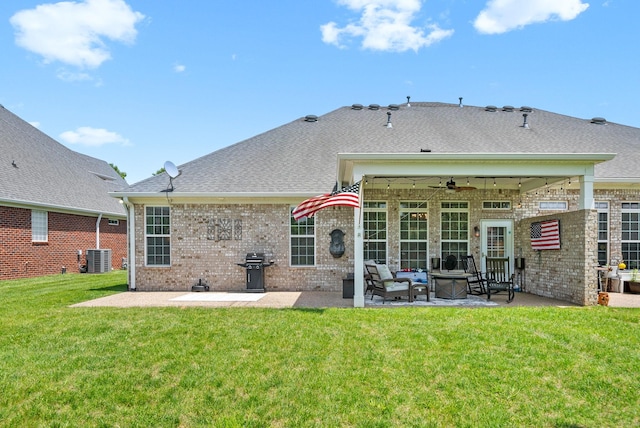 1113 Chickadee Cir, Hermitage, TN 37076 - back of property featuring a patio area, a yard, brick siding, ceiling fan, and an outdoor living space