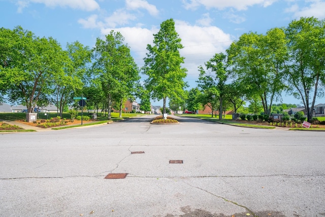 1113 Chickadee Cir, Hermitage, TN 37076 - view of asphalt street with sidewalks, curbs, a residential view, and traffic signs