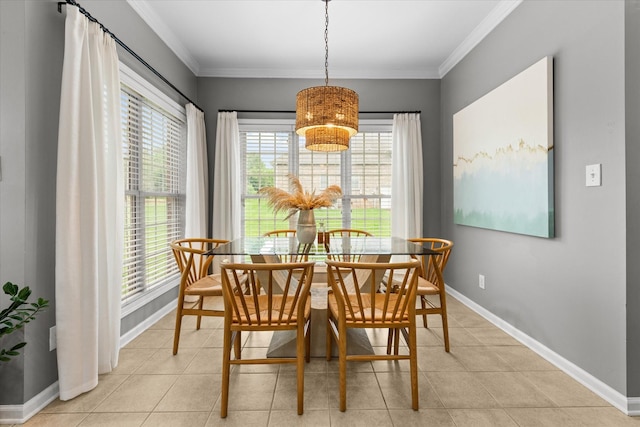 dining room with baseboards, light tile patterned floors, a chandelier, and crown molding