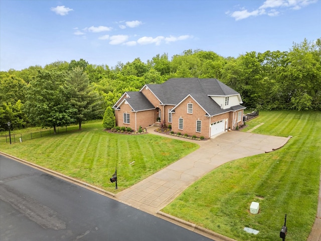 traditional-style house featuring brick siding, driveway, and a garage