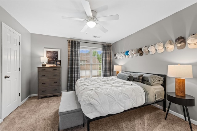 bedroom with carpet, baseboards, and ceiling fan