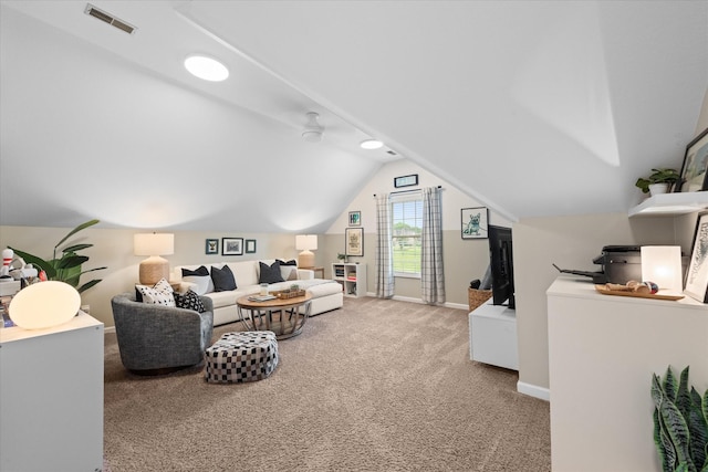 carpeted living room featuring baseboards and vaulted ceiling