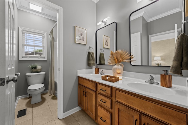 full bath with crown molding, toilet, tile patterned flooring, double vanity, and baseboards