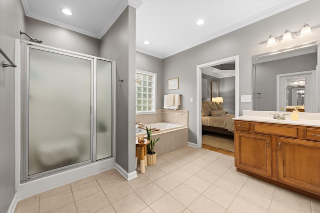 full bathroom featuring a shower stall, ornamental molding, a garden tub, vanity, and tile patterned flooring