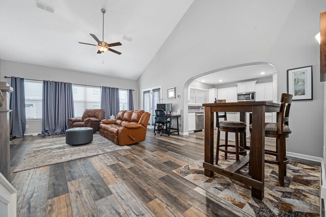 1626 Calcutta Dr, Murfreesboro, TN 37128 - living room with a ceiling fan, high vaulted ceiling, arched walkways, dark wood-style floors, and baseboards