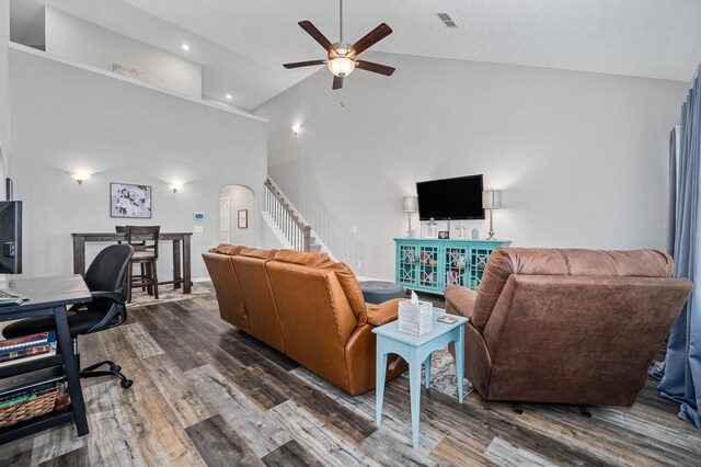 1626 Calcutta Dr, Murfreesboro, TN 37128 - living room featuring a ceiling fan, dark wood-style flooring, stairs, high vaulted ceiling, and arched walkways