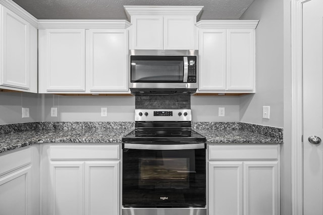 1626 Calcutta Dr, Murfreesboro, TN 37128 - kitchen with appliances with stainless steel finishes, white cabinets, dark stone countertops, and a textured ceiling