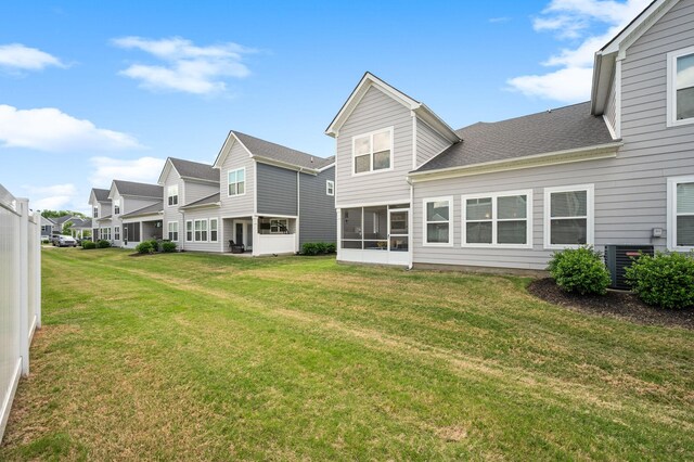 1626 Calcutta Dr, Murfreesboro, TN 37128 - back of house with a yard, a shingled roof, a residential view, and a sunroom