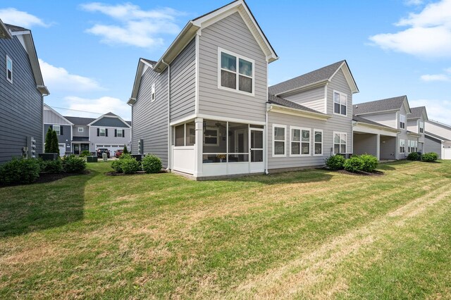 1626 Calcutta Dr, Murfreesboro, TN 37128 - back of property with a sunroom and a lawn