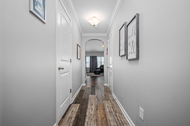 1626 Calcutta Dr, Murfreesboro, TN 37128 - corridor featuring arched walkways, dark wood-style floors, crown molding, baseboards, and a textured ceiling