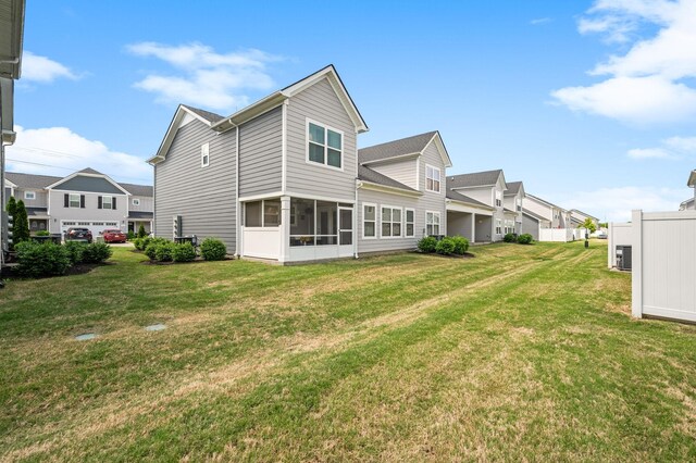 1626 Calcutta Dr, Murfreesboro, TN 37128 - back of property featuring a yard, a residential view, and a sunroom