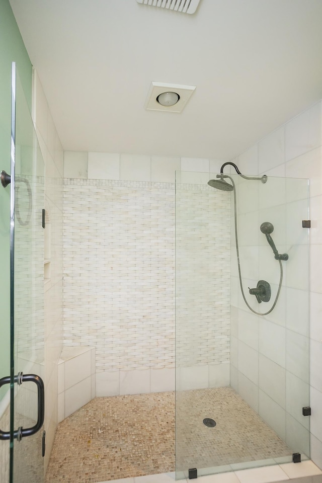 bathroom with a shower stall