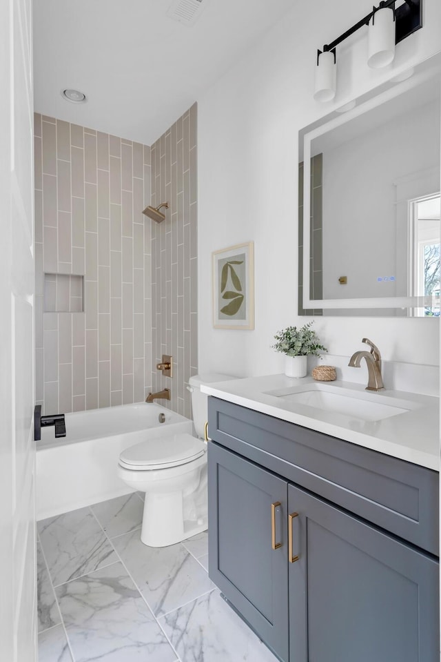 603B Freedom Ct, Nashville, TN 37209 - full bathroom featuring toilet, shower / tub combination, vanity, and marble look tiles