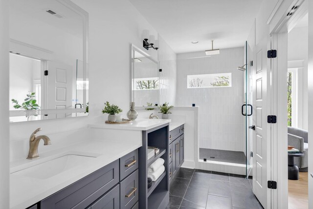 603B Freedom Ct, Nashville, TN 37209 - full bath with a stall shower, vanity, and tile patterned floors