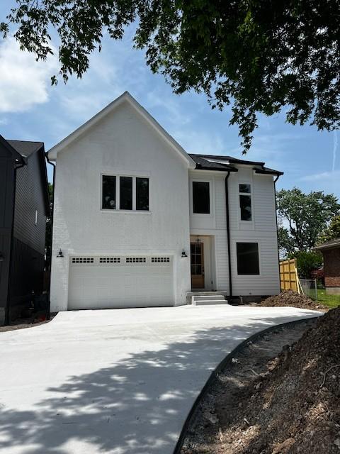 603B Freedom Ct, Nashville, TN 37209 - view of front facade featuring an attached garage and driveway