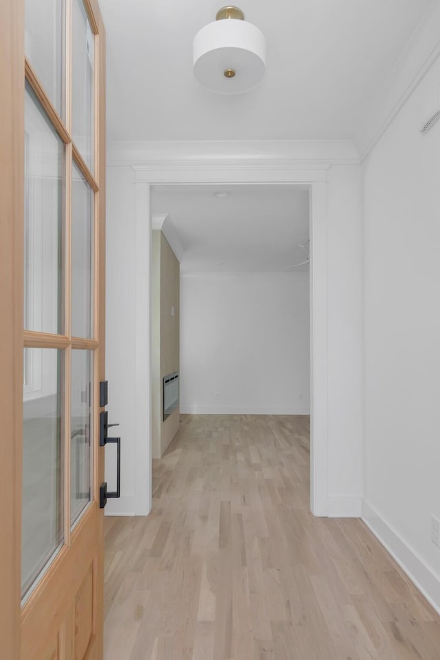 6401 Thunderbird Dr, Nashville, TN 37209 - hallway featuring wood finished floors, baseboards, heating unit, and crown molding
