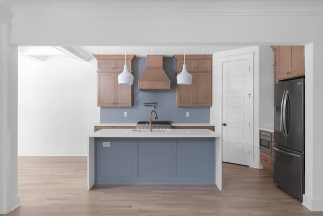 6401 Thunderbird Dr, Nashville, TN 37209 - kitchen featuring refrigerator with ice dispenser, custom range hood, light countertops, light wood-type flooring, and tasteful backsplash