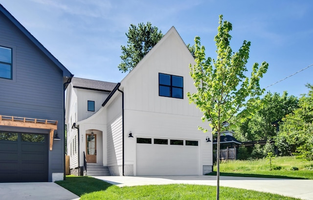 6401 Thunderbird Dr, Nashville, TN 37209 - view of front of home featuring an attached garage, concrete driveway, and board and batten siding