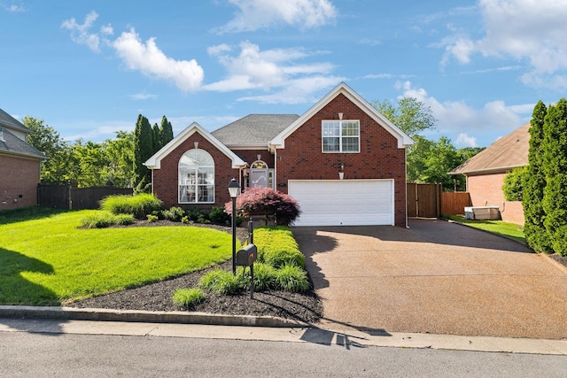 traditional-style home featuring a garage, concrete driveway, and brick siding