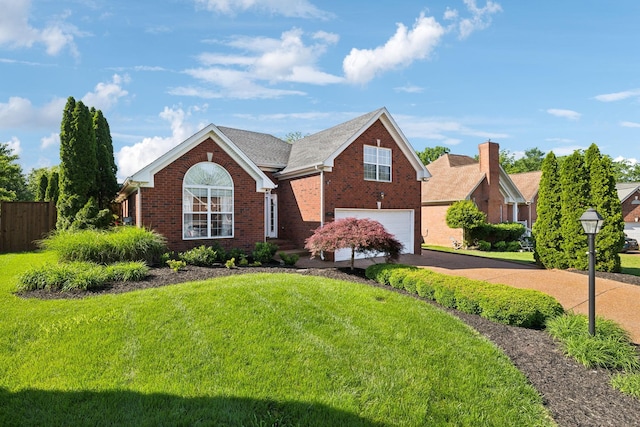 view of front of home featuring an attached garage, driveway, and brick siding