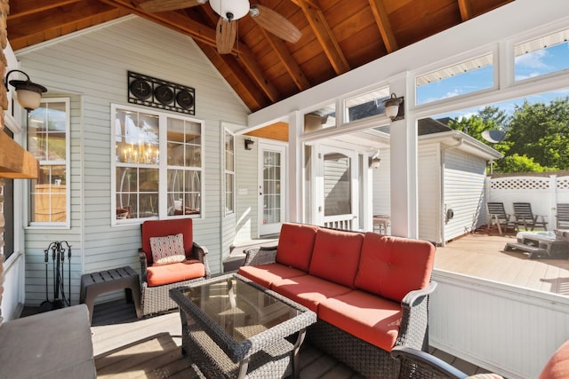 sunroom / solarium with an outdoor hangout area and a ceiling fan