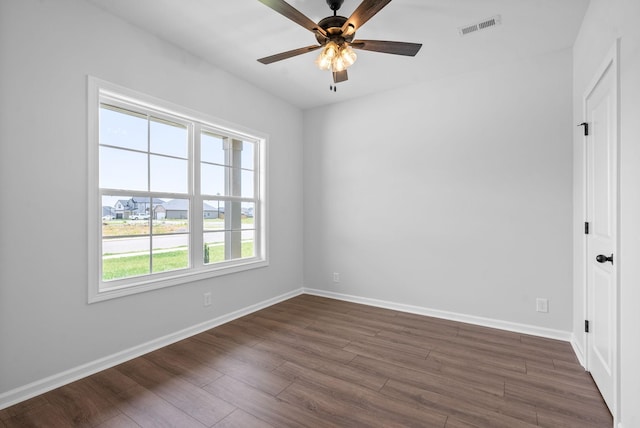 272 Kildeer Dr, Clarksville, TN 37040 - spare room featuring dark wood-type flooring, a ceiling fan, and baseboards